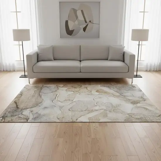 Beige And Ivory Abstract Washable Area Rug With UV Protection Photo 1