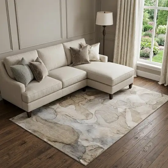 Beige And Ivory Abstract Washable Area Rug With UV Protection Photo 1