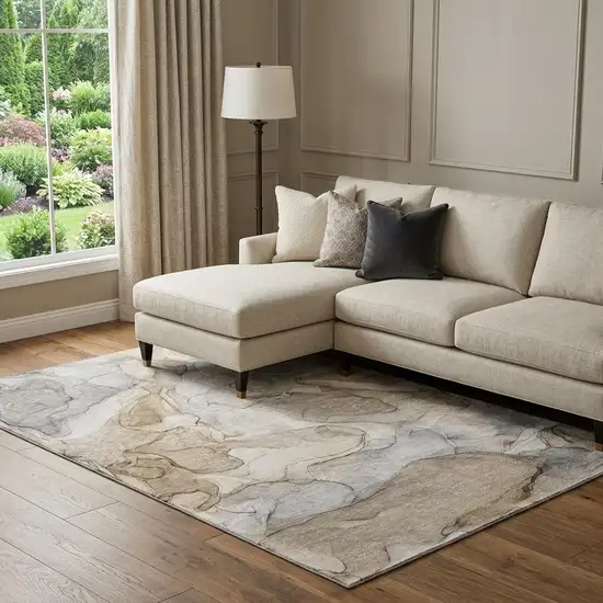 Beige And Ivory Abstract Washable Area Rug With UV Protection Photo 1