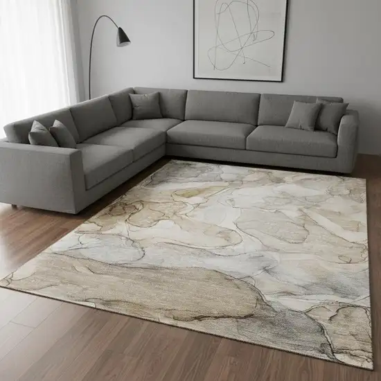Beige And Ivory Abstract Washable Area Rug With UV Protection Photo 1