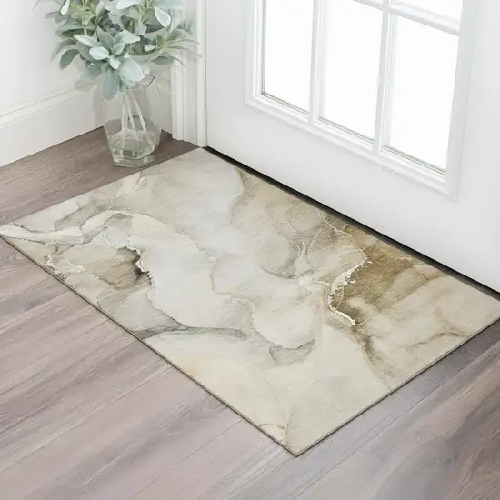 Beige And Ivory Abstract Washable Area Rug With UV Protection Photo 1