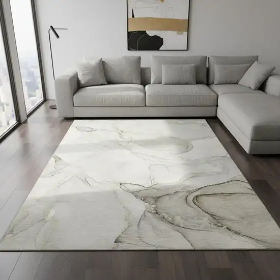 Beige And Ivory Abstract Washable Area Rug With UV Protection Photo 1