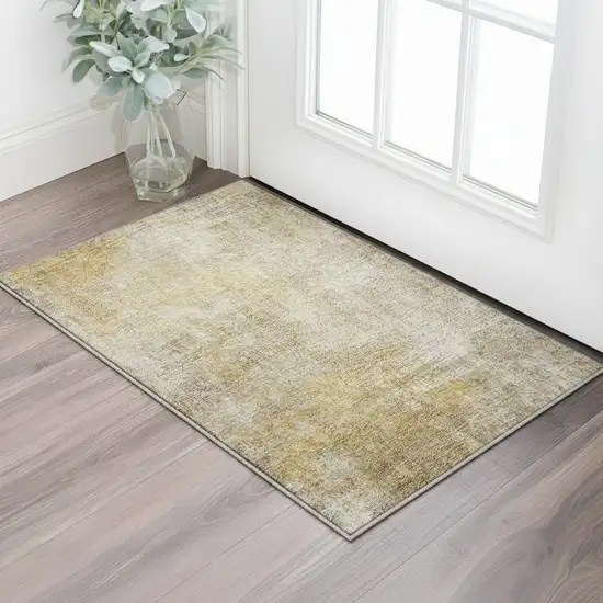 Beige And Ivory Abstract Washable Area Rug With UV Protection Photo 1