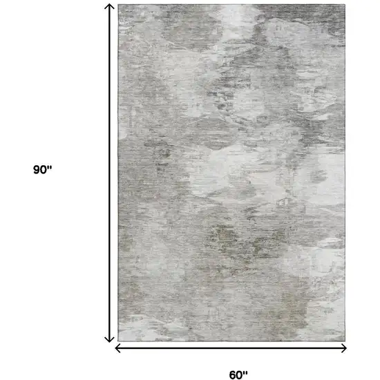 Beige And Ivory Abstract Washable Area Rug With UV Protection Photo 3