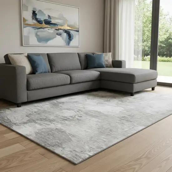 Beige And Ivory Abstract Washable Area Rug With UV Protection Photo 1