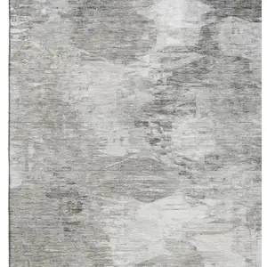 Photo of Beige And Ivory Abstract Washable Area Rug With UV Protection