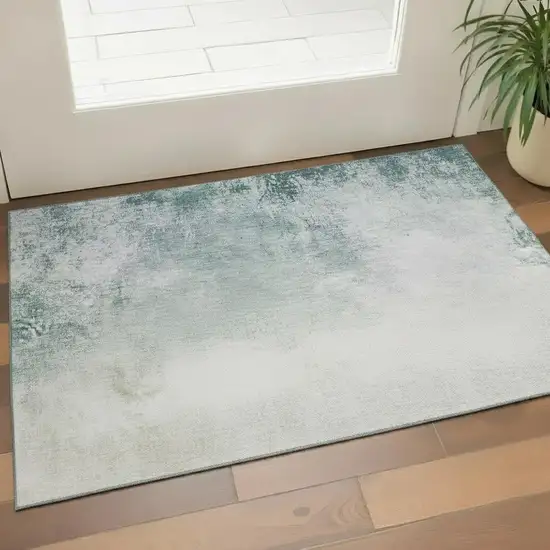 Beige And Ivory Abstract Washable Area Rug With UV Protection Photo 1