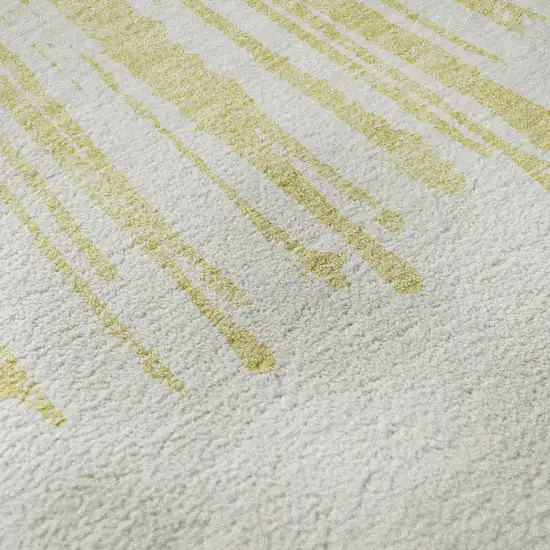 Beige And Ivory Abstract Washable Area Rug With UV Protection Photo 1