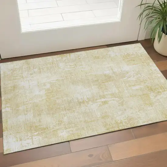 Beige And Ivory Abstract Washable Area Rug With UV Protection Photo 1