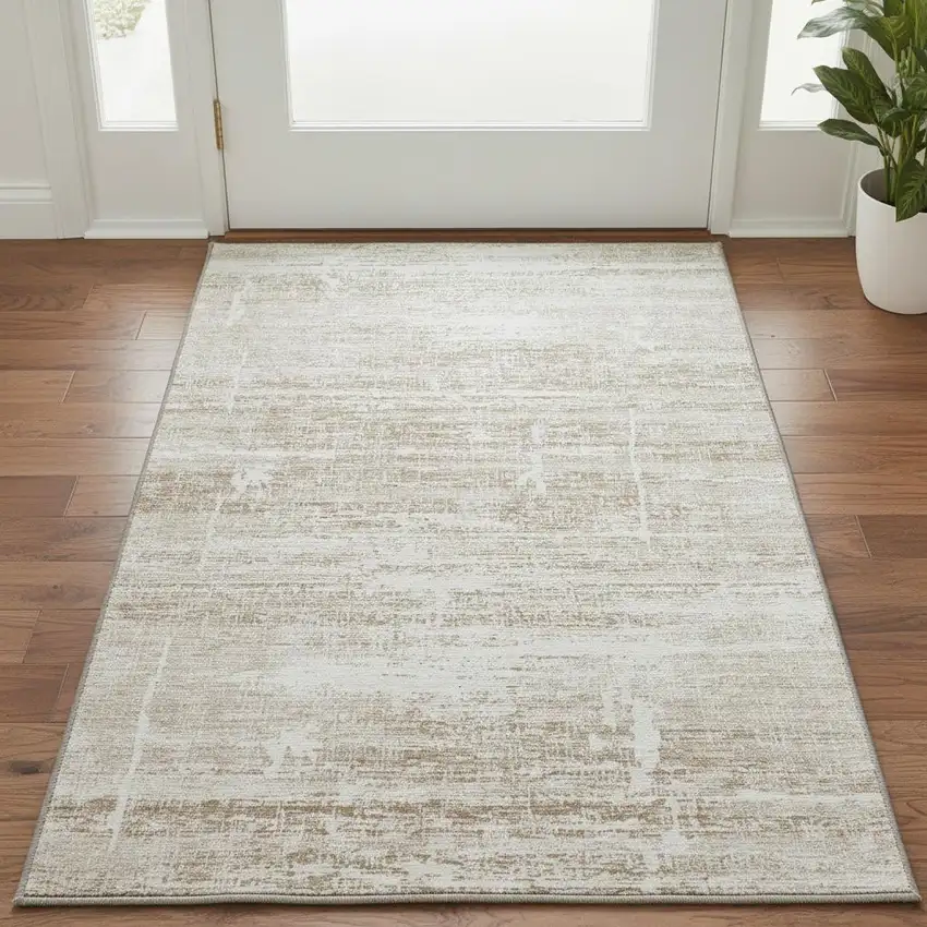 Beige And Ivory Abstract Washable Area Rug With UV Protection Photo 2