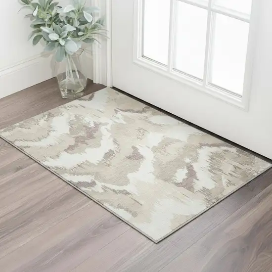 Beige And Ivory Abstract Washable Area Rug With UV Protection Photo 1