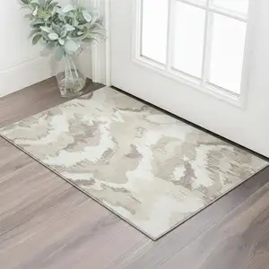 Photo of Beige And Ivory Abstract Washable Area Rug With UV Protection