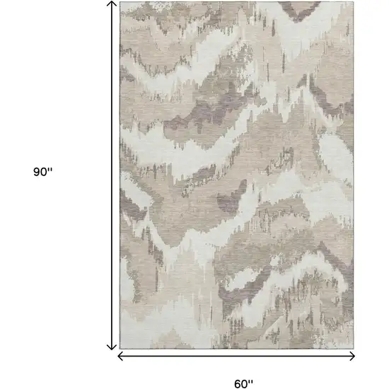 Beige And Ivory Abstract Washable Area Rug With UV Protection Photo 3