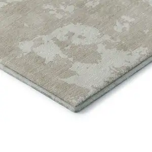 Photo of Beige And Ivory Abstract Washable Area Rug With UV Protection