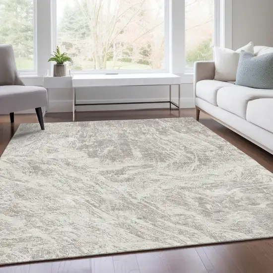 Beige And Ivory Abstract Washable Area Rug With UV Protection Photo 4