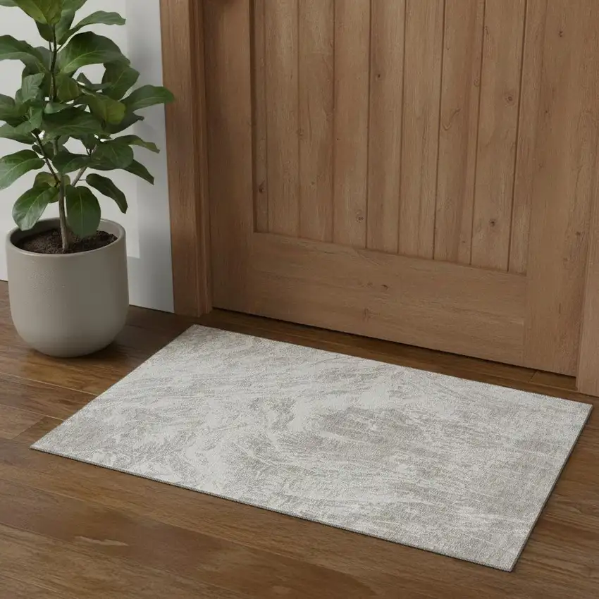 Beige And Ivory Abstract Washable Area Rug With UV Protection Photo 1