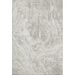 Photo of Beige And Ivory Abstract Washable Area Rug With UV Protection