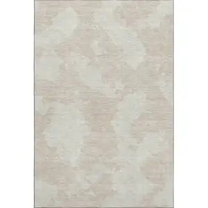 Photo of Beige And Ivory Abstract Washable Area Rug With UV Protection
