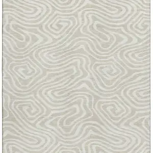Photo of Beige And Ivory Abstract Washable Area Rug With UV Protection