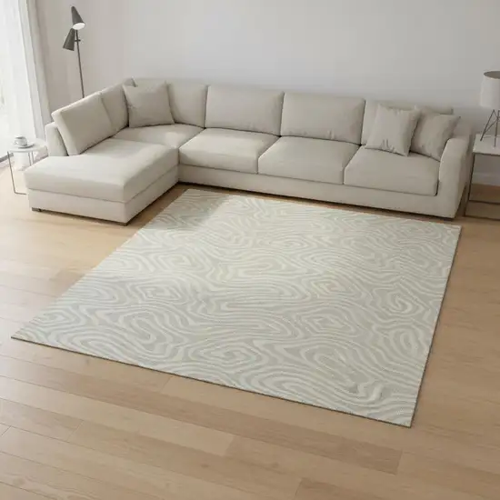 Beige And Ivory Abstract Washable Area Rug With UV Protection Photo 2