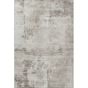 Photo of Beige And Ivory Abstract Washable Area Rug With UV Protection