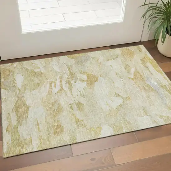Beige And Ivory Abstract Washable Area Rug With UV Protection Photo 1