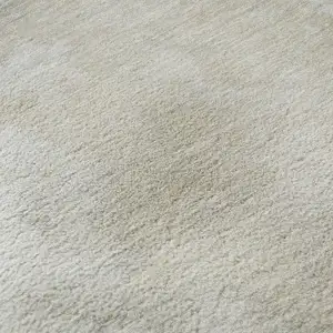 Photo of Beige And Ivory Abstract Washable Area Rug With UV Protection