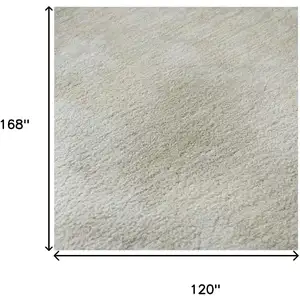 Photo of Beige And Ivory Abstract Washable Area Rug With UV Protection