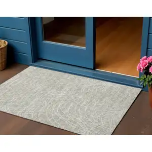 Photo of Beige And Ivory Abstract Washable Indoor Outdoor Area Rug