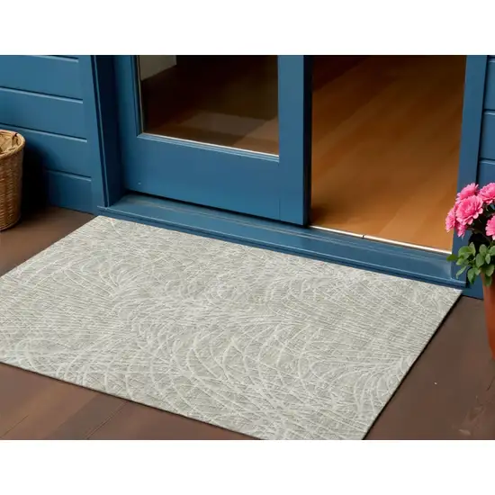 Beige And Ivory Abstract Washable Indoor Outdoor Area Rug Photo 1