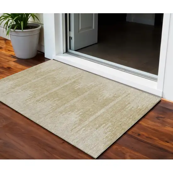 Beige And Ivory Abstract Washable Indoor Outdoor Area Rug Photo 1