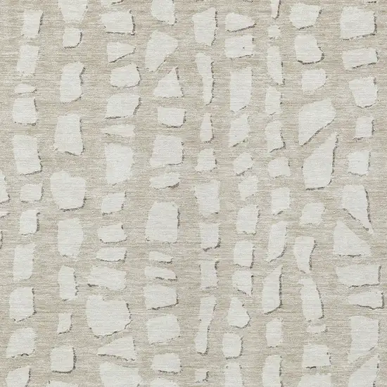 Beige And Ivory Abstract Washable Indoor Outdoor Area Rug Photo 4