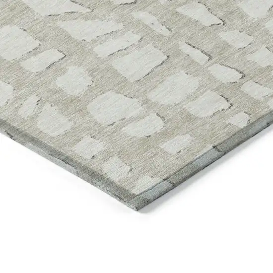 Beige And Ivory Abstract Washable Indoor Outdoor Area Rug Photo 3