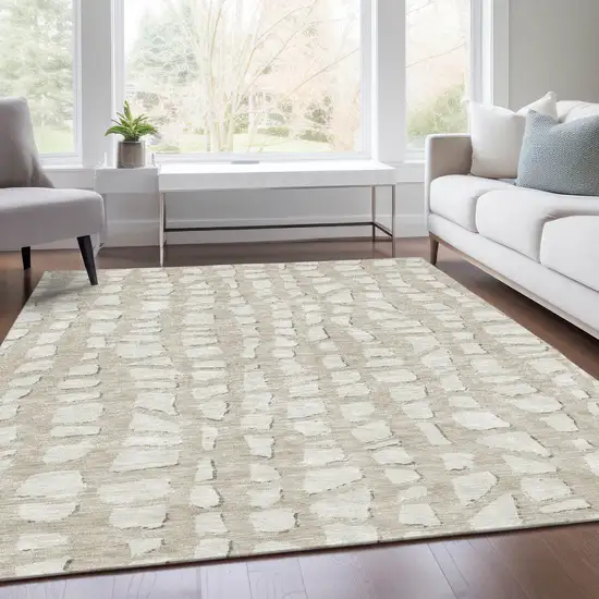 Beige And Ivory Abstract Washable Indoor Outdoor Area Rug Photo 7