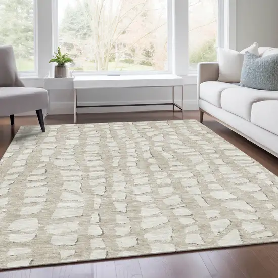 Beige And Ivory Abstract Washable Indoor Outdoor Area Rug Photo 7