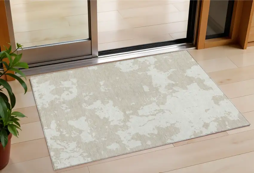 Beige And Ivory Abstract Washable Indoor Outdoor Area Rug Photo 1