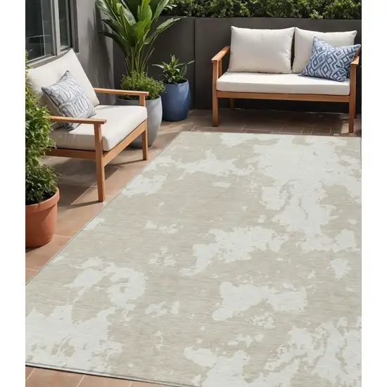 Beige And Ivory Abstract Washable Indoor Outdoor Area Rug Photo 1