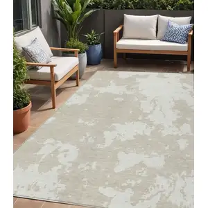 Photo of Beige And Ivory Abstract Washable Indoor Outdoor Area Rug