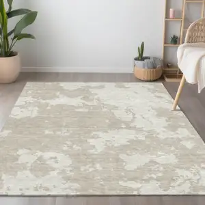 Photo of Beige And Ivory Abstract Washable Indoor Outdoor Area Rug