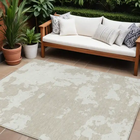 Beige And Ivory Abstract Washable Indoor Outdoor Area Rug Photo 1