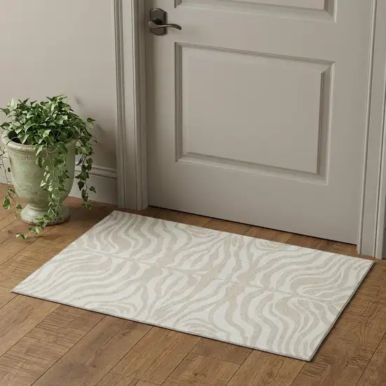 Beige And Ivory Animal Print Washable Area Rug With UV Protection Photo 1