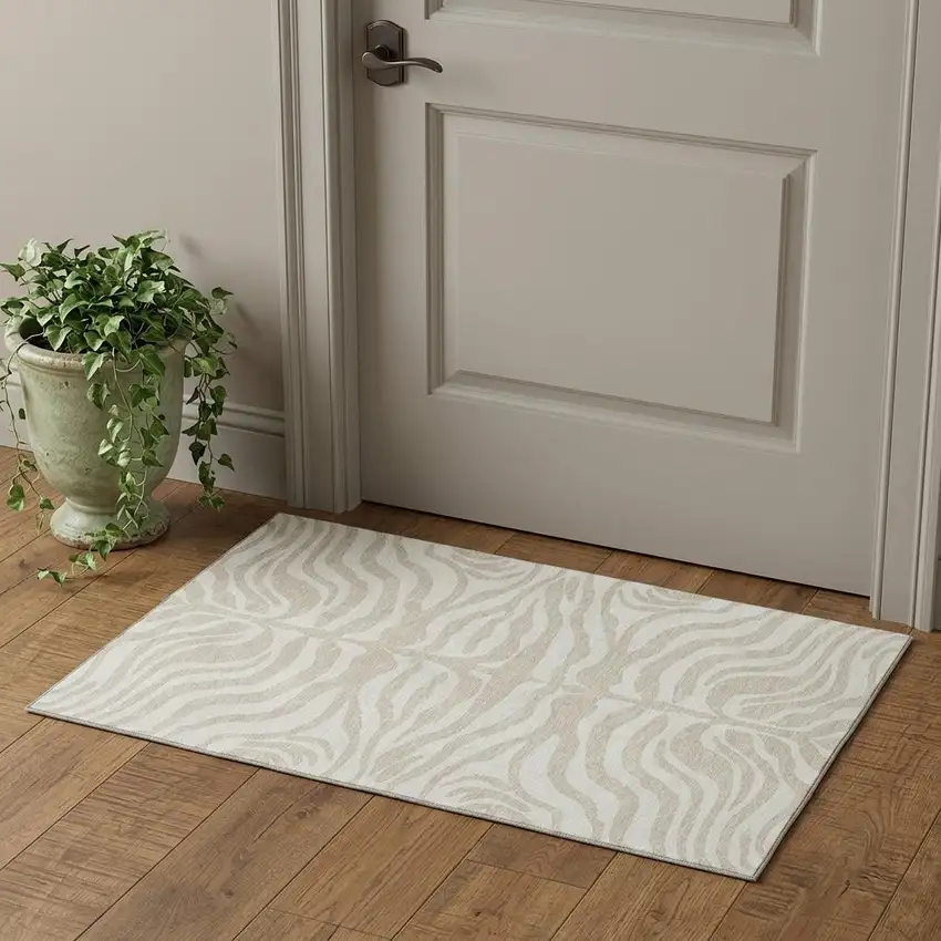 Beige And Ivory Animal Print Washable Area Rug With UV Protection Photo 1
