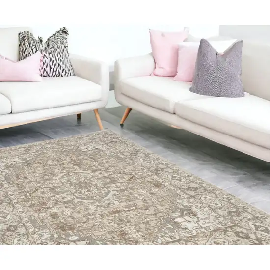 Beige And Ivory Floral Distressed Area Rug Photo 1