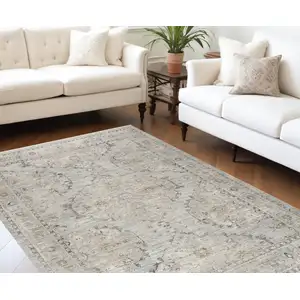 Photo of Beige And Ivory Floral Distressed Area Rug