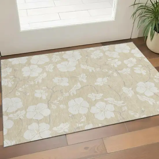 Beige And Ivory Floral Washable Area Rug With UV Protection Photo 1