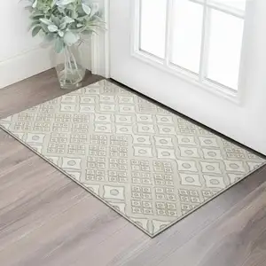 Photo of Beige And Ivory Geometric Washable Area Rug With UV Protection