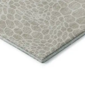 Photo of Beige And Ivory Geometric Washable Area Rug With UV Protection