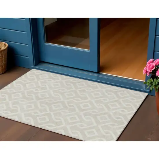 Beige And Ivory Geometric Washable Indoor Outdoor Area Rug Photo 1