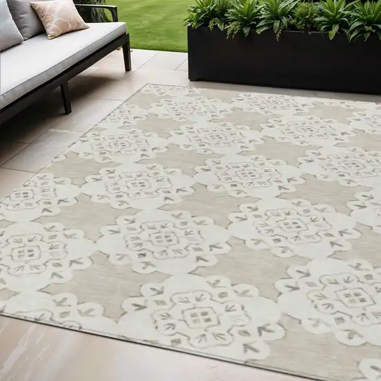 Beige And Ivory Quatrefoil Washable Indoor Outdoor Area Rug Photo 1