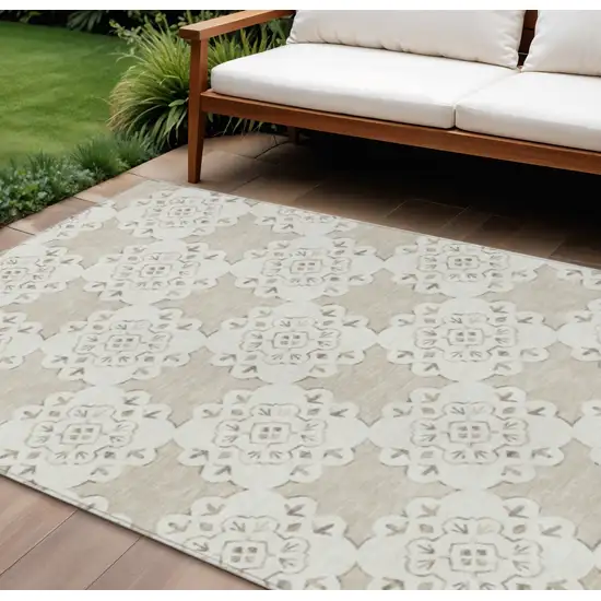 Beige And Ivory Quatrefoil Washable Indoor Outdoor Area Rug Photo 1